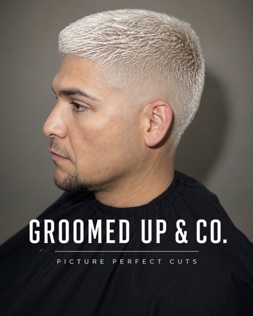 Platinum crop with a skin fade, in profile — a Groomed Up & Co. lookbook card.